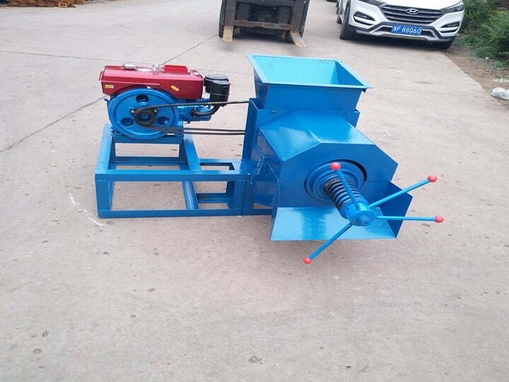 Palm fruit oil press with diesel engine